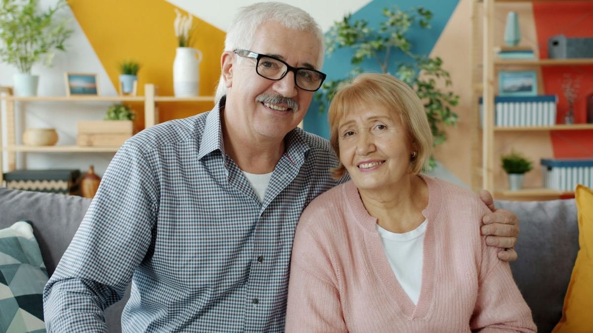 Smiling older couple at home